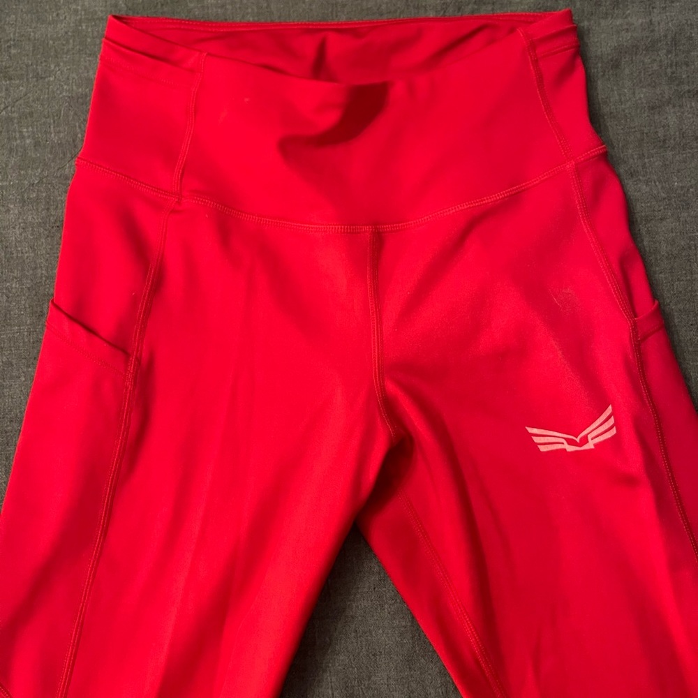 Body Kit Small Leggings, never worn, side pockets and back zipper pocket.